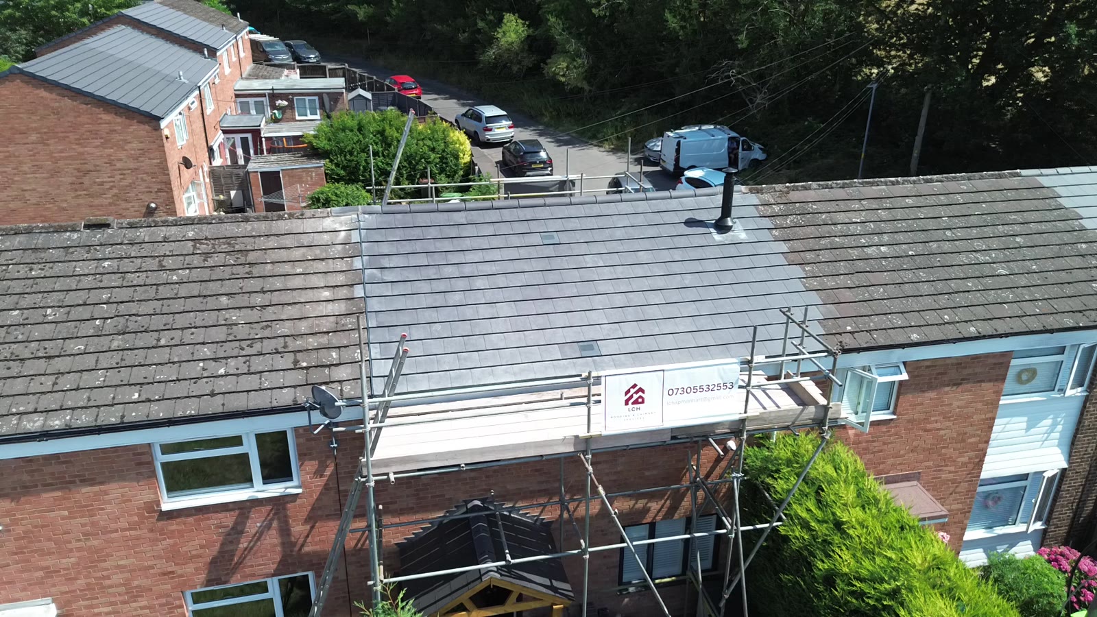 Roof replacement in progress with scaffolding